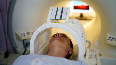 Woman having MRI scan