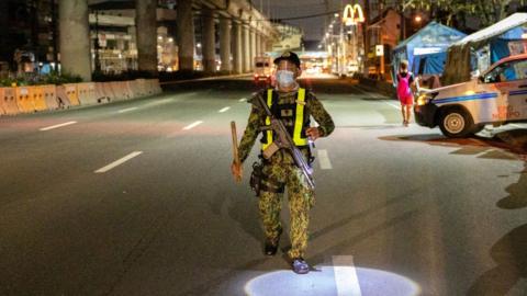 A police officer patrols in the Philippines