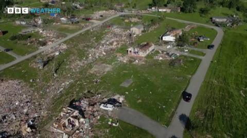 Image showing a few houses standing with ones around them flattened by a tornado