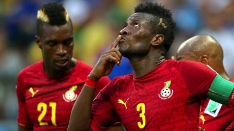 Asamoah Gyan celebrates scoring a goal for Ghana