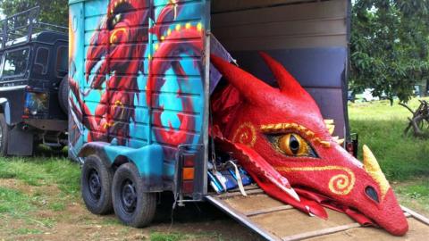 Dragon props in a trailer