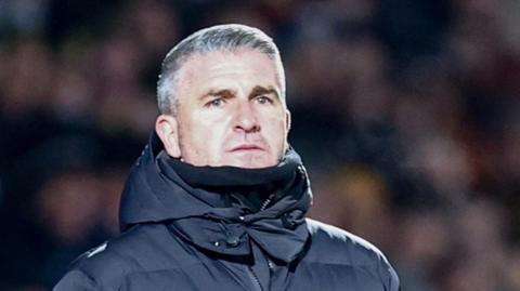 Ryan Lowe looks on from the touchline during Wigan Athletic's game against Burton Albion in December
