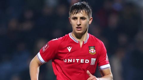 Wrexham's Max Cleworth runs during a match