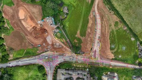 Aerial view of area where roadworks are taking place on the A358. You can see single carriageway near fields.