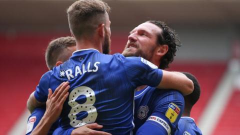 Sean Morrison celebrates goal with hug of team-mates