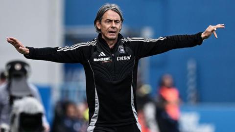 Filippo Inzaghi has his arms outstretched as he delivers instructions to his Pisa team