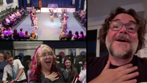 The image is split into three sections.  On the right is an image of Jack Black. He is wearing glasses and holds his hand to his chest. The left hand screen is split into two halves. On the top is a view of the hall with students sat lining the chairs around the stage. On the bottom is the teacher. She has a mouth open in shock. She also has her hand to her chest. 