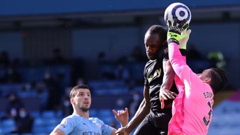 West Ham's Michail Antonio challenges for a header with Manchester City's Ederson