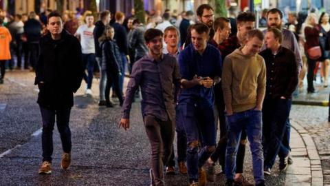 Revellers on Wind Street