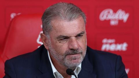 A head and shoulders shot of Ange Postecoglou at a press conference