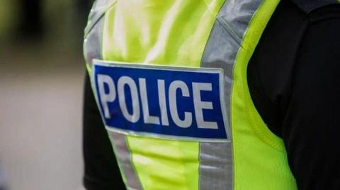 An image of a high-vis police vest.