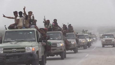 Yemeni forces backed by the Saudi-led coalition advance in the al-Durayhimi district on the outskirts of Hudaydah, 14 June 2018