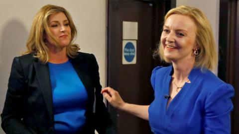 Penny Mordaunt greets Conservative leadership candidate Liz Truss during a hustings event