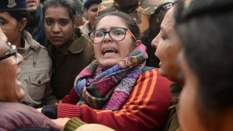 A woman reacts as she confronts police at a demonstration against Indias new citizenship law in New Delhi on December 19, 2019