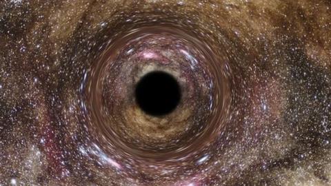 An artist's impression of a black hole surrounded by stars