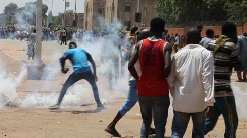 Nigerien security forces launch tear gas to disperse pro-junta demonstrators gathered outside the French embassy, in Niamey, the capital city of Niger July 30, 2023.