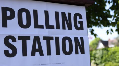 Image of a polling station sign