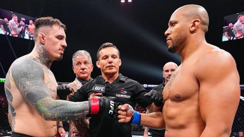 Tom Aspinall and Ciryl Gane touch gloves before their UFC fight in October 2025