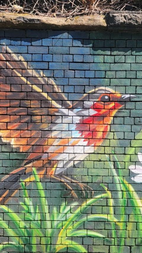 Painting on a wall of a Robin