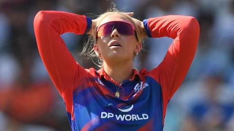 Southern Brave bowler Sarah Glenn puts her hands on her head in frustration