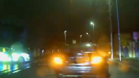 Car speeds through residential area in Peterborough at night