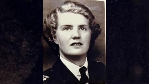 Head and shoulders wartime photo of nurse Monica Stutt of her wearing the uniform she donated