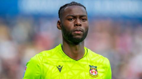 Arthur Okonkwo in action for Wrexham at Bolton