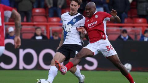 Bristol City's Sinclair Armstrong battles for possession with Birmingham City's Phil Neumann
