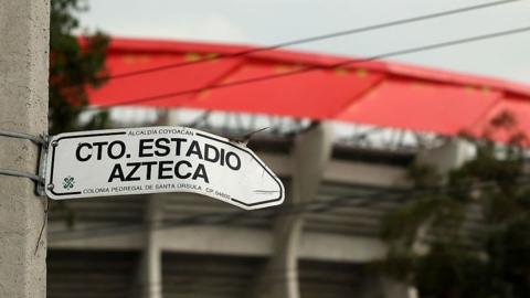 A sign pointing to Mexico City's Azteca Stadium