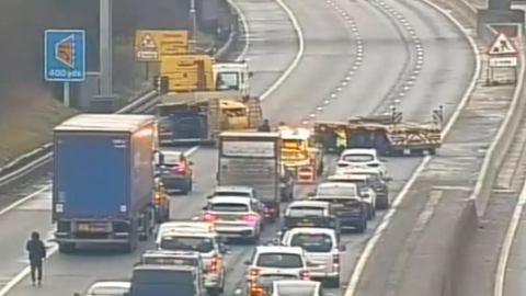 Traffic camera footage showing the trailer across the M1 southbound and traffic being held. 