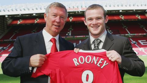 Sir Alex Ferguson and Wayne Rooney at Old Trafford with a Manchester United shirt