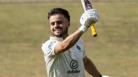 Middlesex's Joe Cracknell celebrates his maiden first-class century