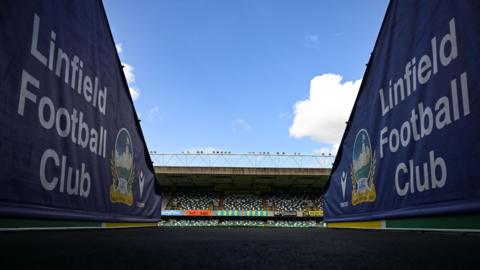 A view of two Linfield crests at Windsor Park