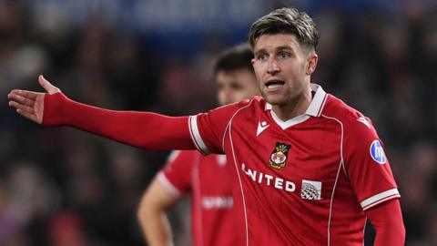 Josh Windass holds out his arm