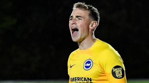 Tom McGill in action for Brighton Under-21 side