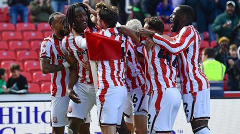 Stoke players celebrate Bosun Lawal's goal against Birmingham