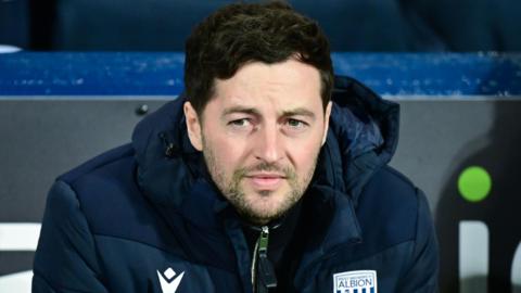 Ryan Mason sitting in the West Bromwich Albion dugout