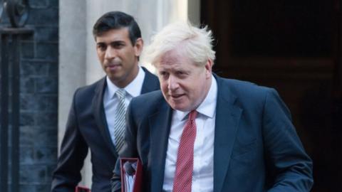 British Prime Minister Boris Johnson (R) and Chancellor of the Exchequer Rishi Sunak leave 10 Downing Street in central London to attend a Cabinet meeting as Parliament returns after summer recess amid the ongoing Coronavirus pandemic on 01 September, 2020