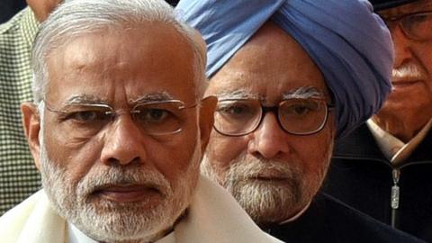 Indian Prime Minister Narendra Modi and former PM from the Congress, Manmohan Singh