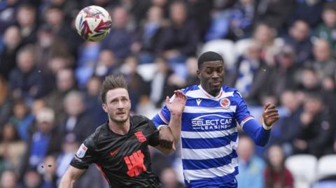 Kelvin Ehibhatiomhan of Reading and Ben Davies of Birmingham City