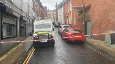 A police Landrover sits on a street in londonderry