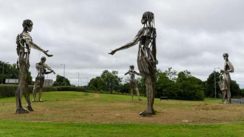 A Millennium Project sculpture named 'Let the Dance Begin' stands near the Irish border in Strabane, Northern Ireland