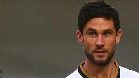 Andrew Surman in action for MK Dons