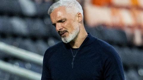 Dundee United manager Jim Goodwin in left disappointed