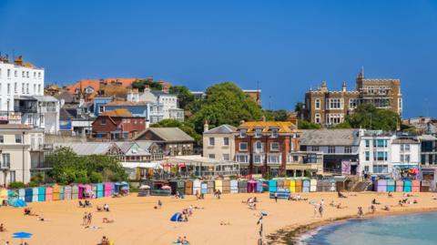 A sandy beach and pretty English-seaside town. 