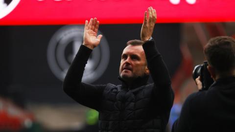 Nathan Jones claps supporters