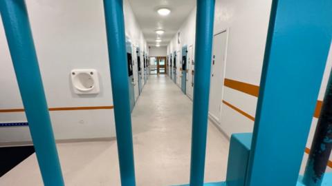 Custody suite pictured through bars