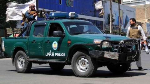 Taliban fighters secure the scene in Kabul, 18 June