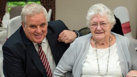 Kevin Hughes and his mother June Margaret Hughes with a woman