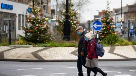 A man and woman walking